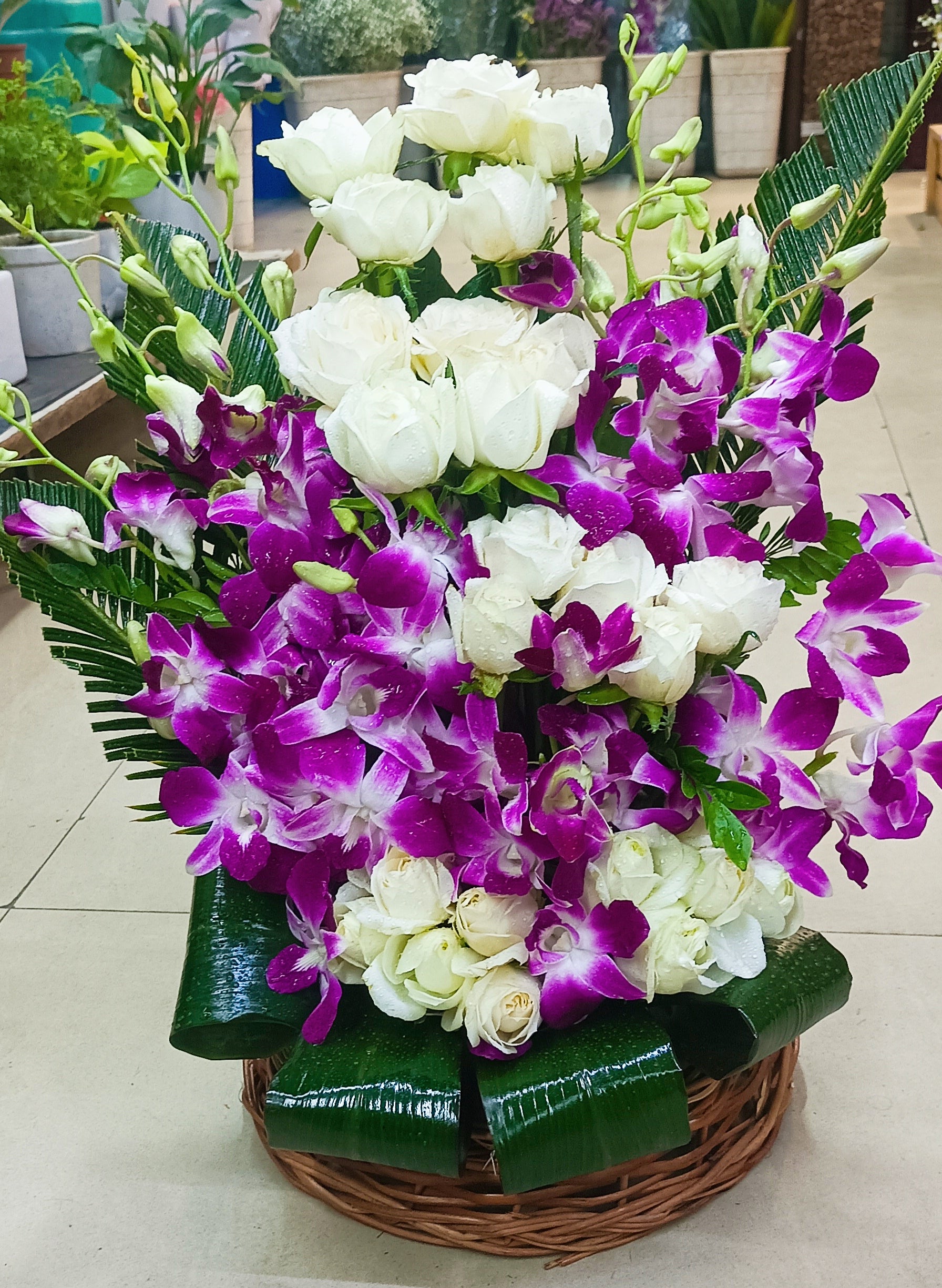 Purple orchid with white rose