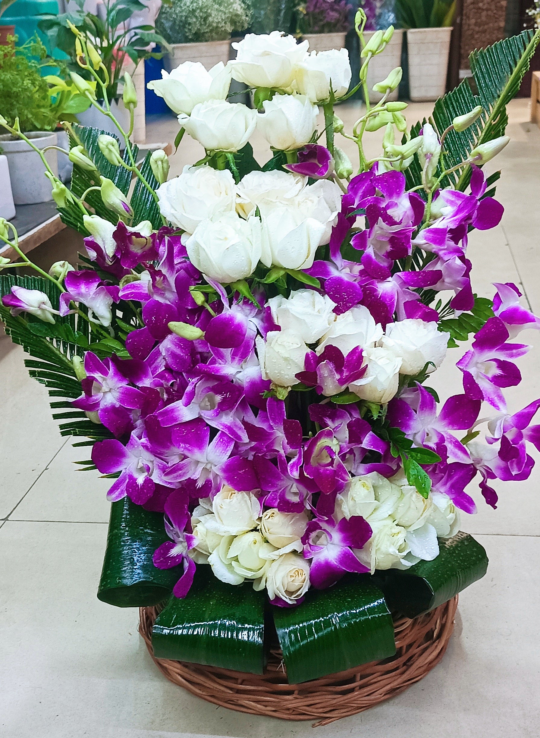 Purple orchid with white rose